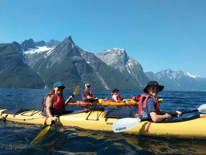 https://www.norway-adventures.com/wp-content/uploads/2022/11/Family-kayaking-on-Hjorundfjord-in-Norway.jpg