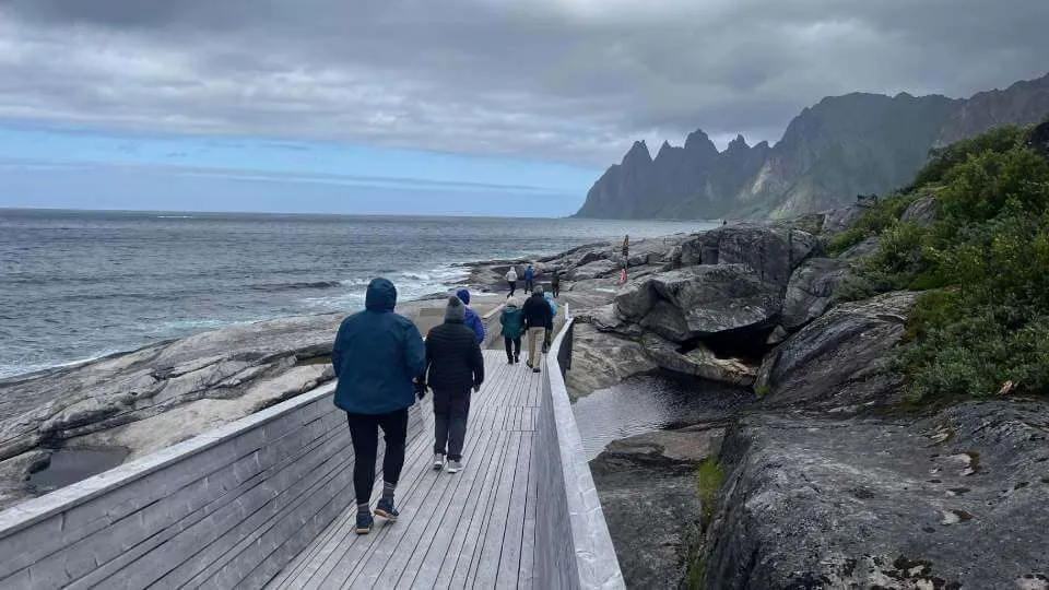 Group walking in Northern Norway coastline